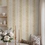 Gold and white wallpaper with antique gold leafy sprig stripes on parchment cream