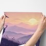 Stag mountain wallpaper with a navy deer silhouette, lavender pine ridges and a pale golden sun
