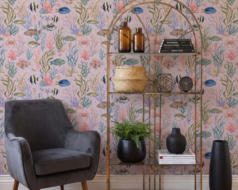 Cute pink seashell wallpaper with watercolour reef fish, coral, seaweed, starfish and shells on blush pink