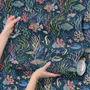 Aquarium fish tank wallpaper repeat with tropical fish, coral, seaweed, shells and bubbles on deep navy blue