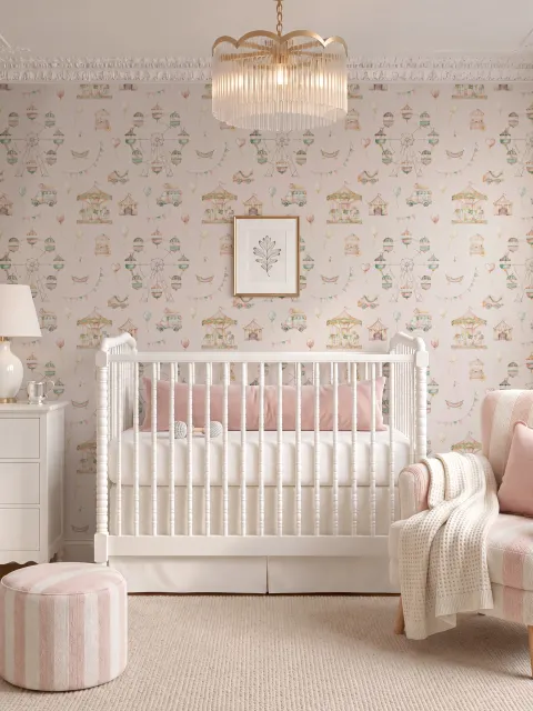Children's playroom wallpaper with pastel Ferris wheel, carousel horses, tents and balloons on blush pink