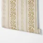Gold and white wallpaper with antique gold leafy sprig stripes on parchment cream