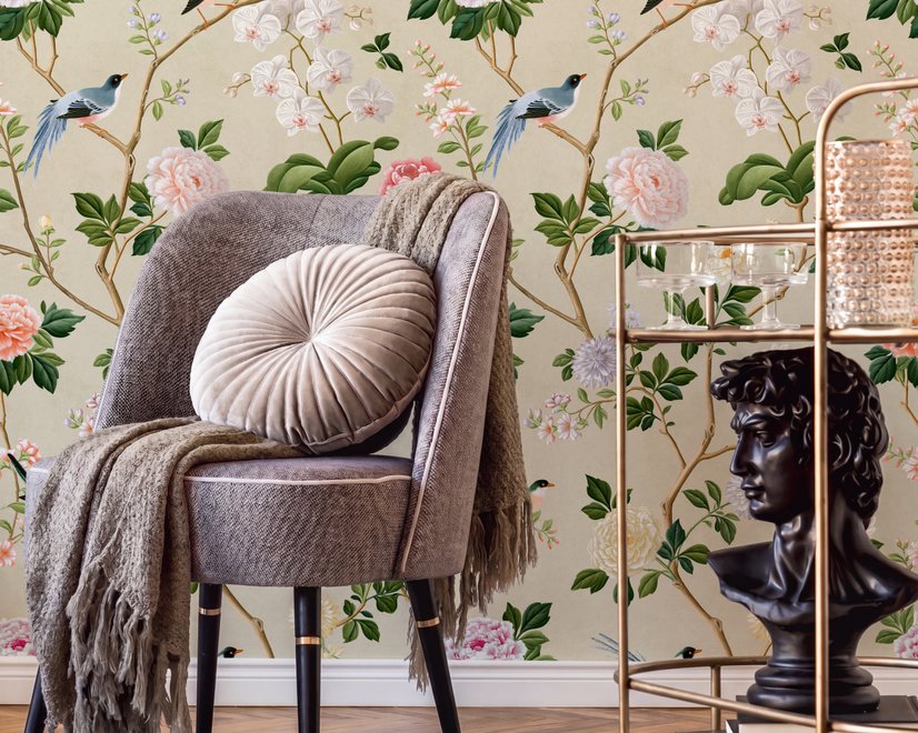 Chinoiserie wallpaper with blue-grey birds, pink peonies, white orchids and green branches on ivory-cream ground