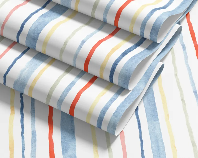 Blue and light blue wallpaper with hand-painted vertical watercolour stripes on a clean white ground