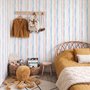 Blue and light blue wallpaper with hand-painted vertical watercolour stripes on a clean white ground