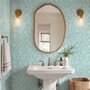 Aqua fern wallpaper with overlapping icy blue palm fronds on a pale aqua ground