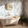 Blue floral wallpaper with watercolour anemone blooms, mint sage leaves and yellow ochre centres on white