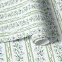 Blue floral stripe wallpaper with pale sky-blue bell flowers, green vines and sage bands on white