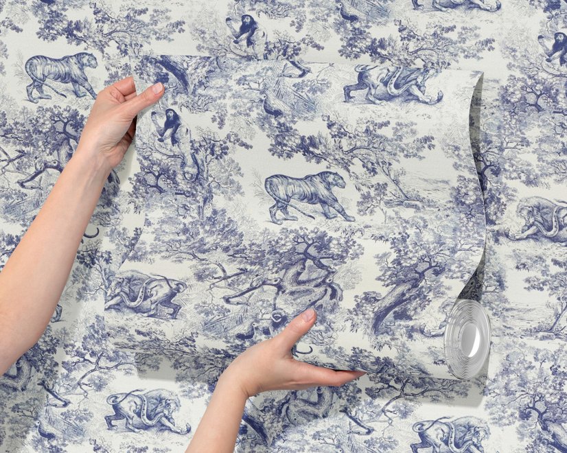 Jungle wallpaper with animals in navy toile, showing tigers, elephants and monkeys on an ivory cream ground