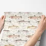 Watercolor fish wallpaper with trout, seashells and pale aqua washes on a warm cream ground