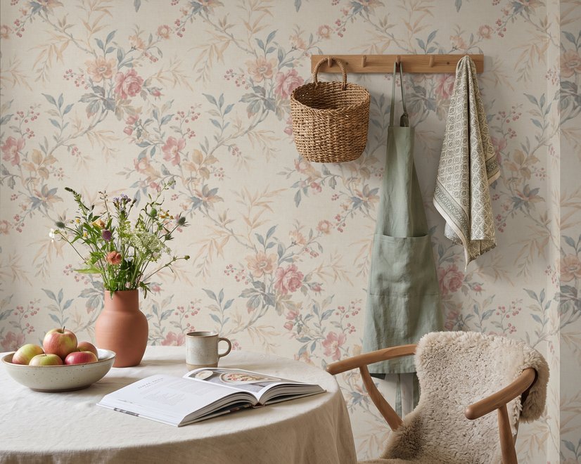Pink chinoiserie wallpaper with watercolor flowers, blue-grey leaves and red berries on a cream linen-texture ground