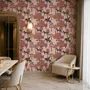 Tropical foliage wallpaper with black panthers, pink palace facades and ochre palms on pale peach