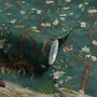 Floral wallpaper with birds in a teal chinoiserie garden with blossoms, pheasant, palms and stone railings