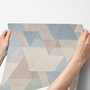Pastel abstract wallpaper with overlapping sky blue, blush, cream, sage and grey textured triangles