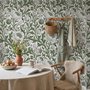 Sage green botanical floral wallpaper with white poppy flowers, lobed leaves and dotted seed centres
