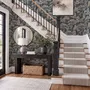 Navy wallpaper with warm ivory and taupe grey toile tree repeat on deep slate blue ground