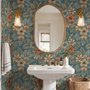 Blue tropical wallpaper with hibiscus, orchids, lilies, monstera leaves and palm fronds on a deep teal-blue ground