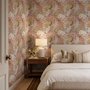 Pink tropical wallpaper with ivory fan palms, orchids, coral blossoms and sage foliage on dusty rose