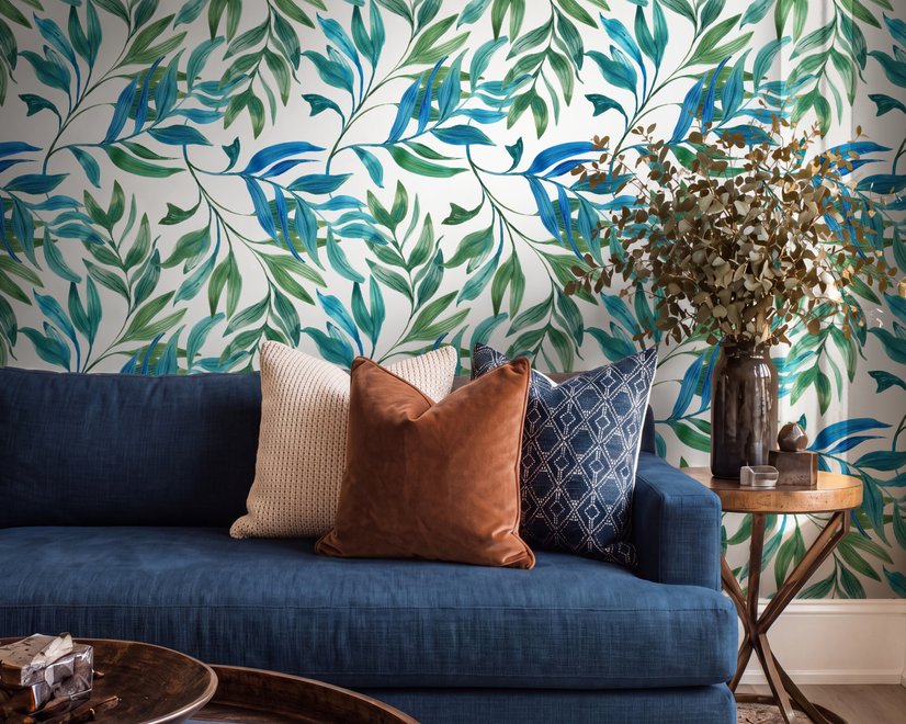 Dark olive green wallpaper with teal and cobalt watercolour lance leaves on a white ground