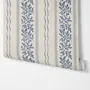 Blue wallpaper with indigo botanical stripework, pinstripes and dotted borders on warm cream parchment