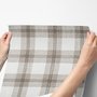 Neutral beige and brown plaid wallpaper with cream squares, taupe woven blocks and fine dark brown lines