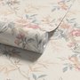 Pink chinoiserie wallpaper with watercolor flowers, blue-grey leaves and red berries on a cream linen-texture ground