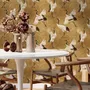 Japanese crane wallpaper with white, black and red cranes in flight on an antique-gold textured ground
