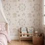 Children's playroom wallpaper with pastel Ferris wheel, carousel horses, tents and balloons on blush pink