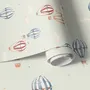 Watercolor blue wallpaper with hot air balloons, cream clouds and peach stars on pale sage green