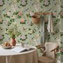 Celadon-sage chinoiserie wallpaper with blue-grey birds, tan branches, pink peonies and white orchids
