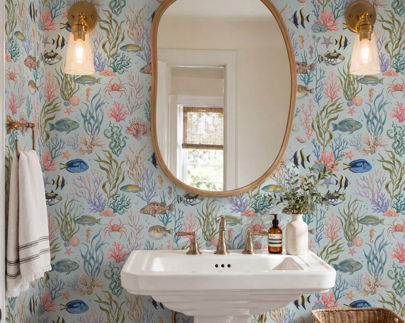 Modern coastal wallpaper with watercolour tropical fish, coral, seaweed, shells and bubbles on light aqua-blue