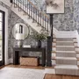 Jungle wallpaper with animals in navy toile, showing tigers, elephants and monkeys on an ivory cream ground