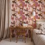 Tropical foliage wallpaper with black panthers, pink palace facades and ochre palms on pale peach