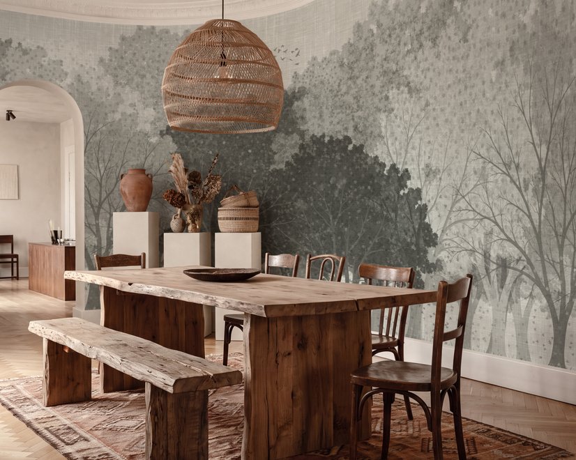Light gray wallpaper mural with layered ink-wash woodland trees, falling leaves and birds