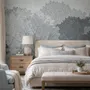 Light gray wallpaper mural with misty forest trees, falling leaves and birds