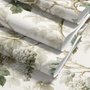 Vintage nature wallpaper with pale monkeys, sage grape leaves, white grape clusters and taupe vines on ivory.