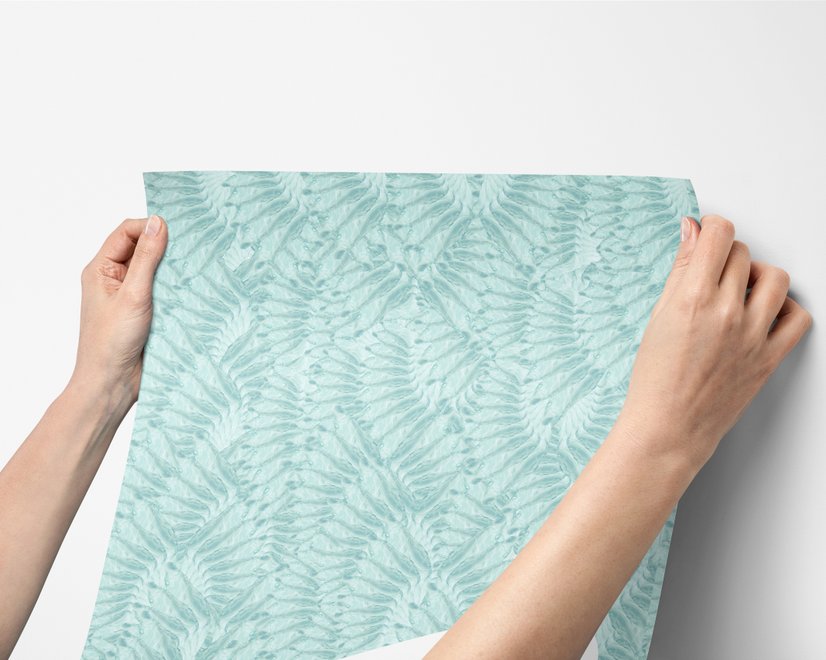 Aqua fern wallpaper with overlapping icy blue palm fronds on a pale aqua ground