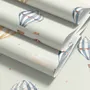 Watercolor blue wallpaper with hot air balloons, cream clouds and peach stars on pale sage green
