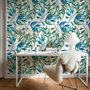 Dark olive green wallpaper with teal and cobalt watercolour lance leaves on a white ground