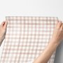 Soft brown wallpaper with pale beige gingham checks on a warm cream off-white ground