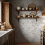 Black outline botanical wallpaper with charcoal wildflowers and grasses on a warm ivory cream ground