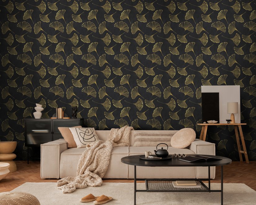 Black wallpaper with antique metallic gold ginkgo leaves on a mottled charcoal ground