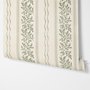 Green aesthetic wallpaper with sage leafy sprigs, fine vertical rules and dotted borders on cream ivory