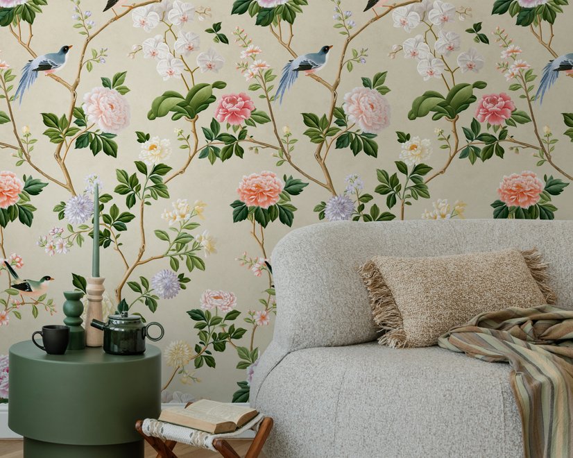 Chinoiserie wallpaper with blue-grey birds, pink peonies, white orchids and green branches on ivory-cream ground