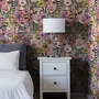 Bold wallpaper for powder room with pop art female faces, pink flowers, black comic panels, mustard, teal and fuchsia details