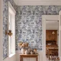 Jungle wallpaper with animals in navy toile, showing tigers, elephants and monkeys on an ivory cream ground