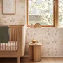 Children's playroom wallpaper with pastel Ferris wheel, carousel horses, tents and balloons on blush pink