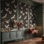 Ivory cranes and antique gold lotus flowers on charcoal-black Japanese lotus wallpaper