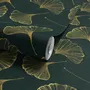 Dark green wallpaper with metallic antique-gold etched ginkgo leaves on a textured forest-green teal ground