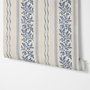 Blue wallpaper with indigo botanical stripework, pinstripes and dotted borders on warm cream parchment